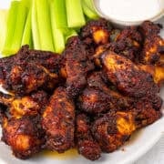 BBQ chicken wings on a serving platter.