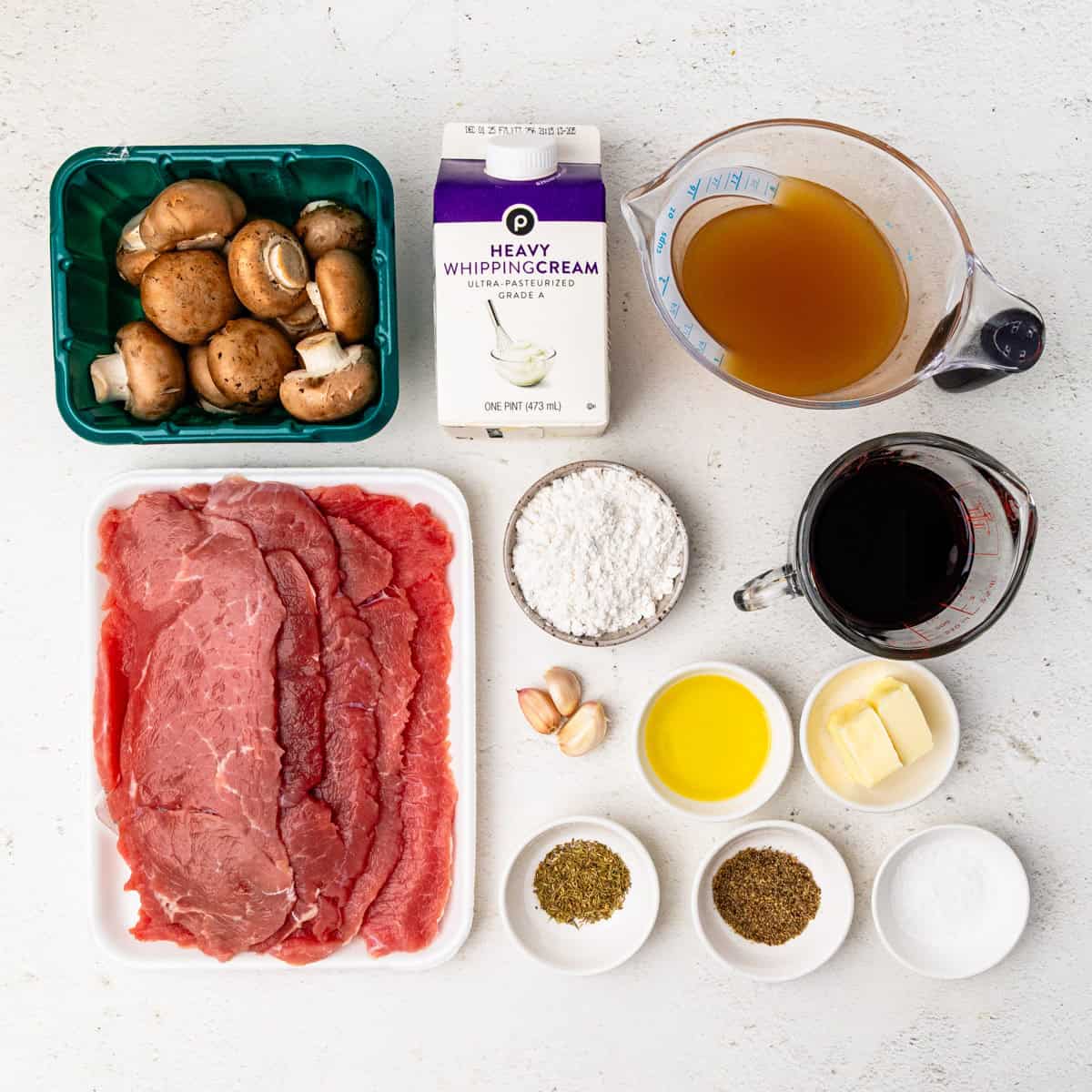 Ingredients for veal marsala arranged on a countertop.