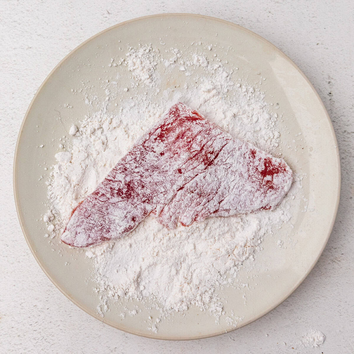 A veal cutlet dredged in flour.