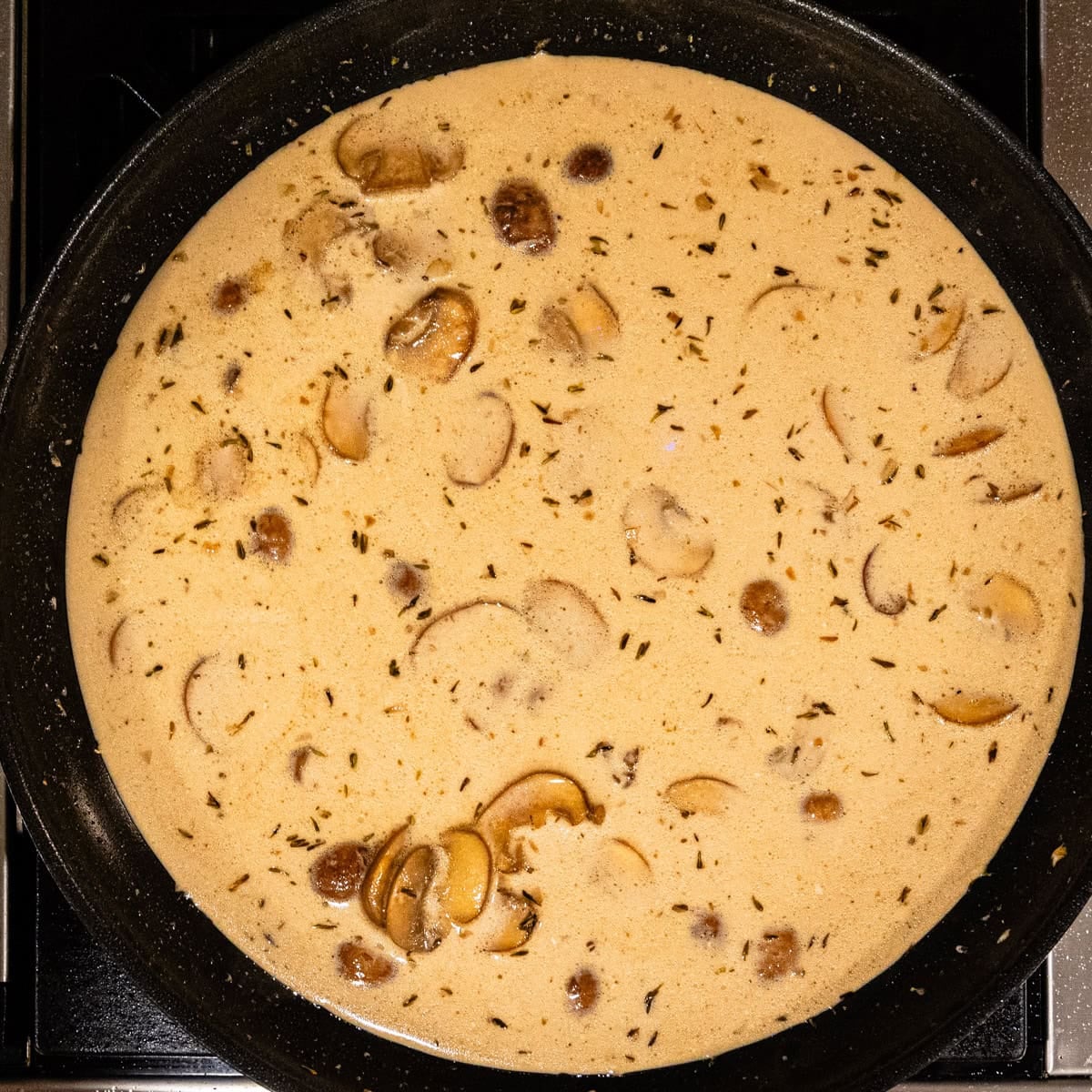 Creamy marsala sauce in a skillet.