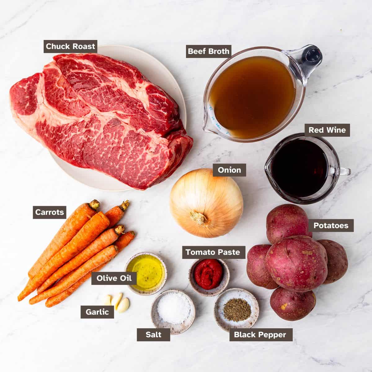 Ingredients for braised chuck roast arranged on a countertop.
