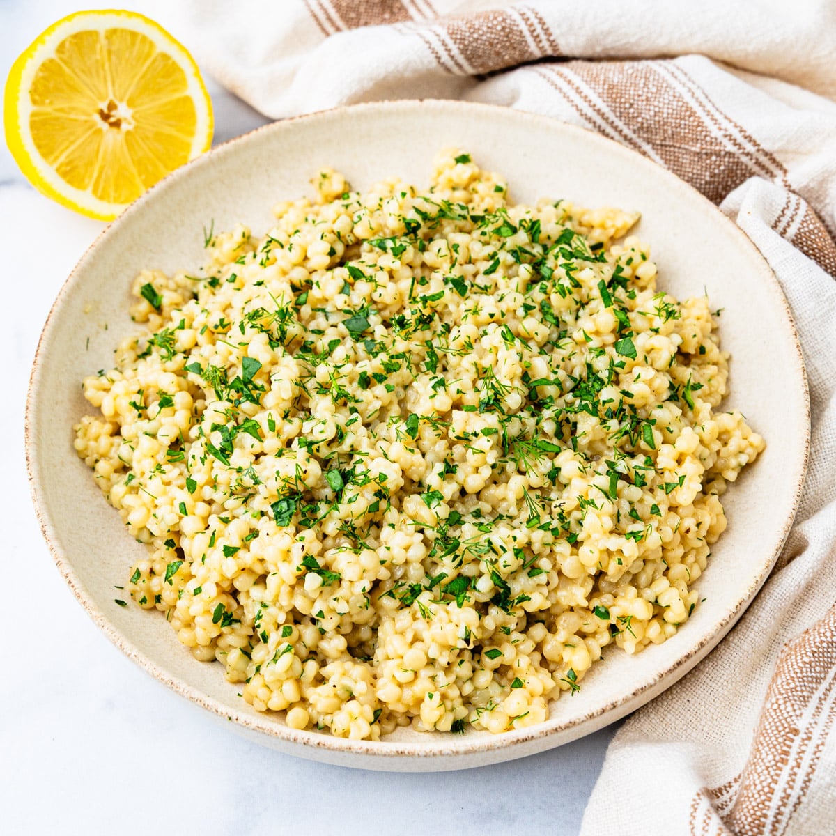 A bowl of lemon and herb couscous.