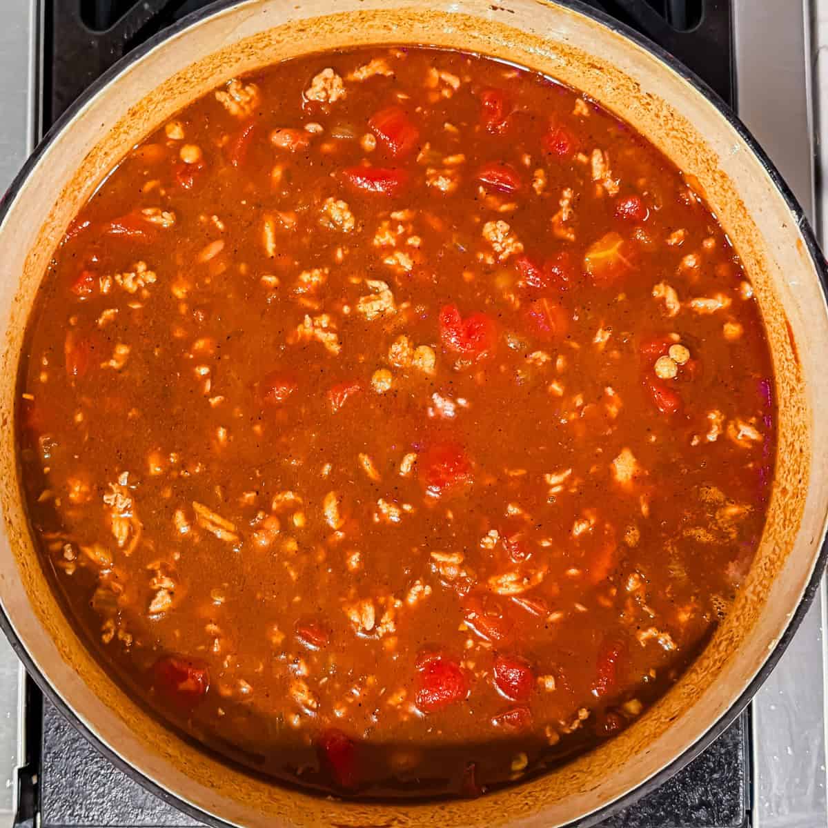 Chili in a Dutch oven before being simmered and reduced.
