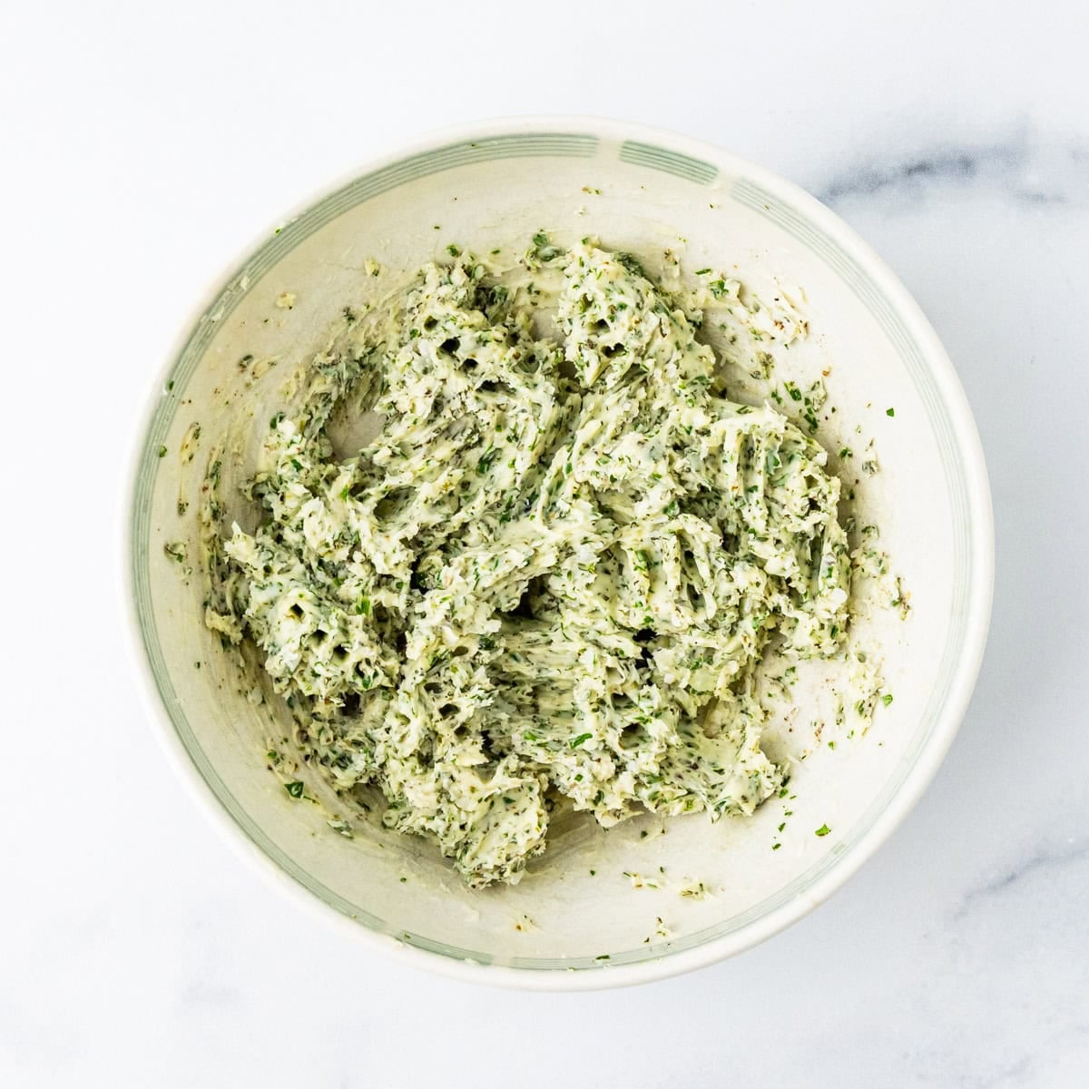 Herb butter in a small bowl.