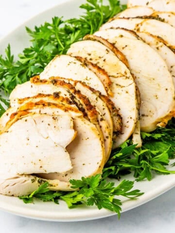 Boneless turkey breast on a serving platter.