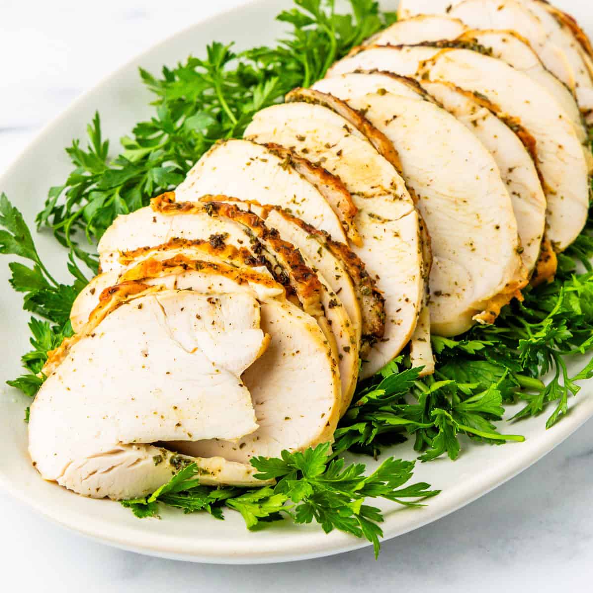 Boneless turkey breast on a serving platter.