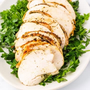 Sliced boneless turkey breast on a platter.
