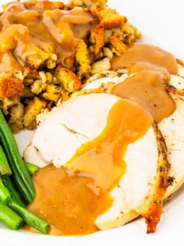 Roasted turkey breast smothered in gravy.