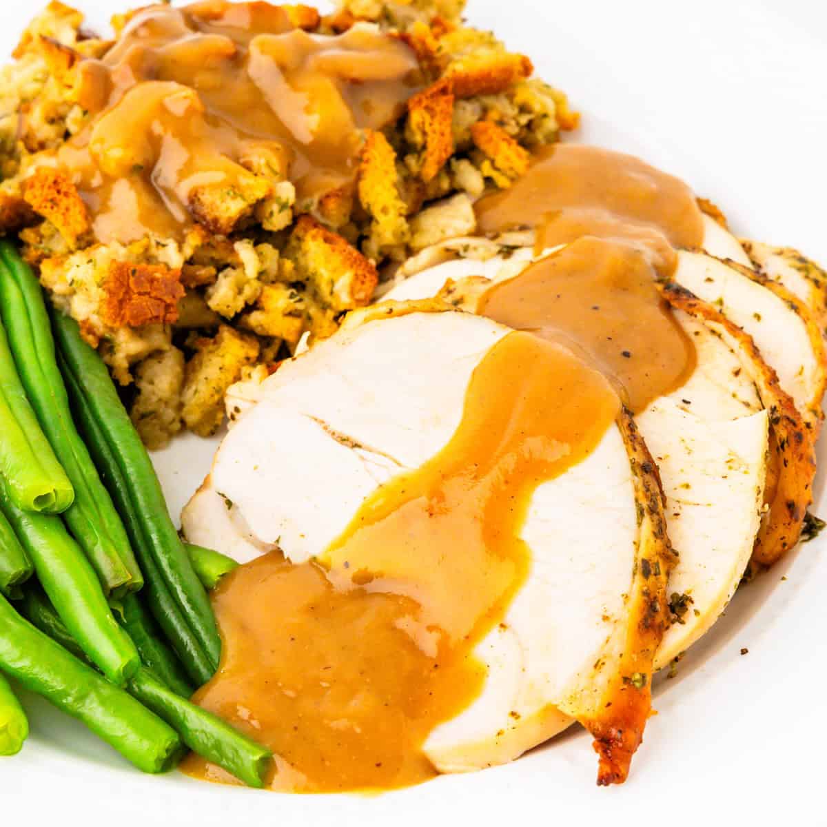 Roasted turkey breast smothered in gravy.