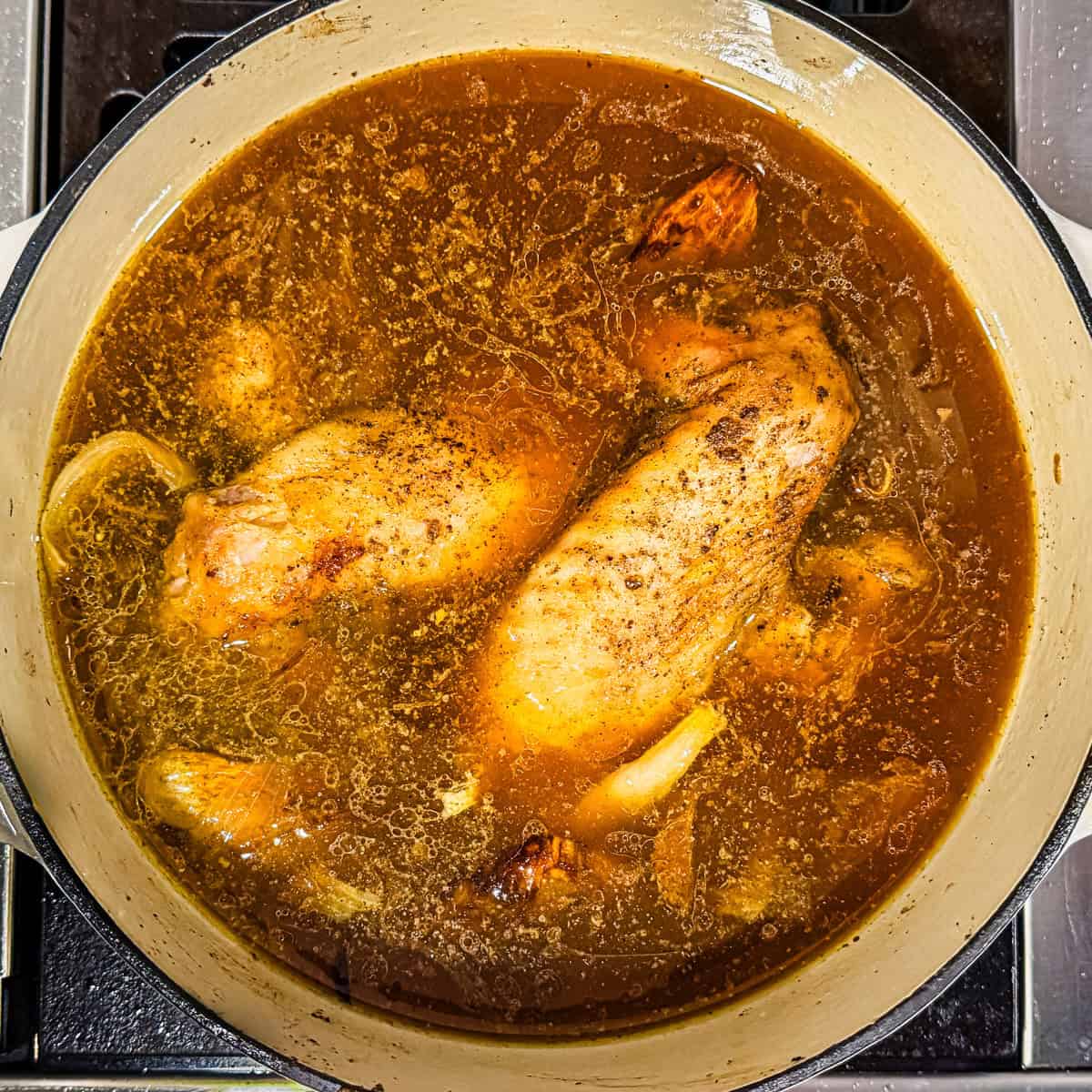 Turkey wings in a stock pot.