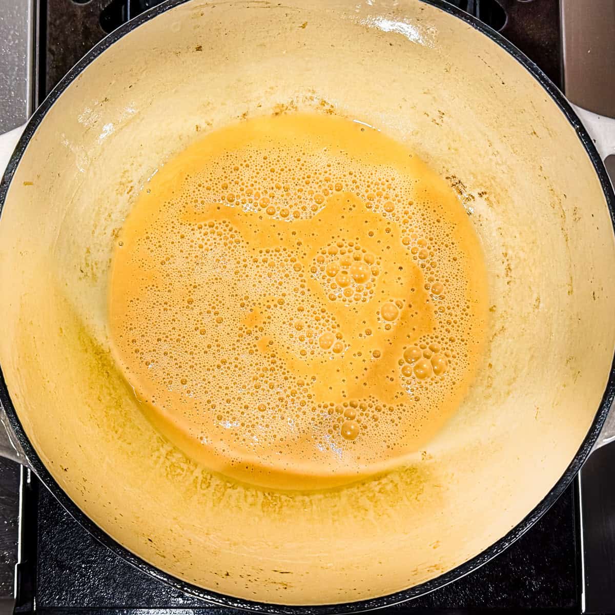 A golden brown roux in a Dutch oven.