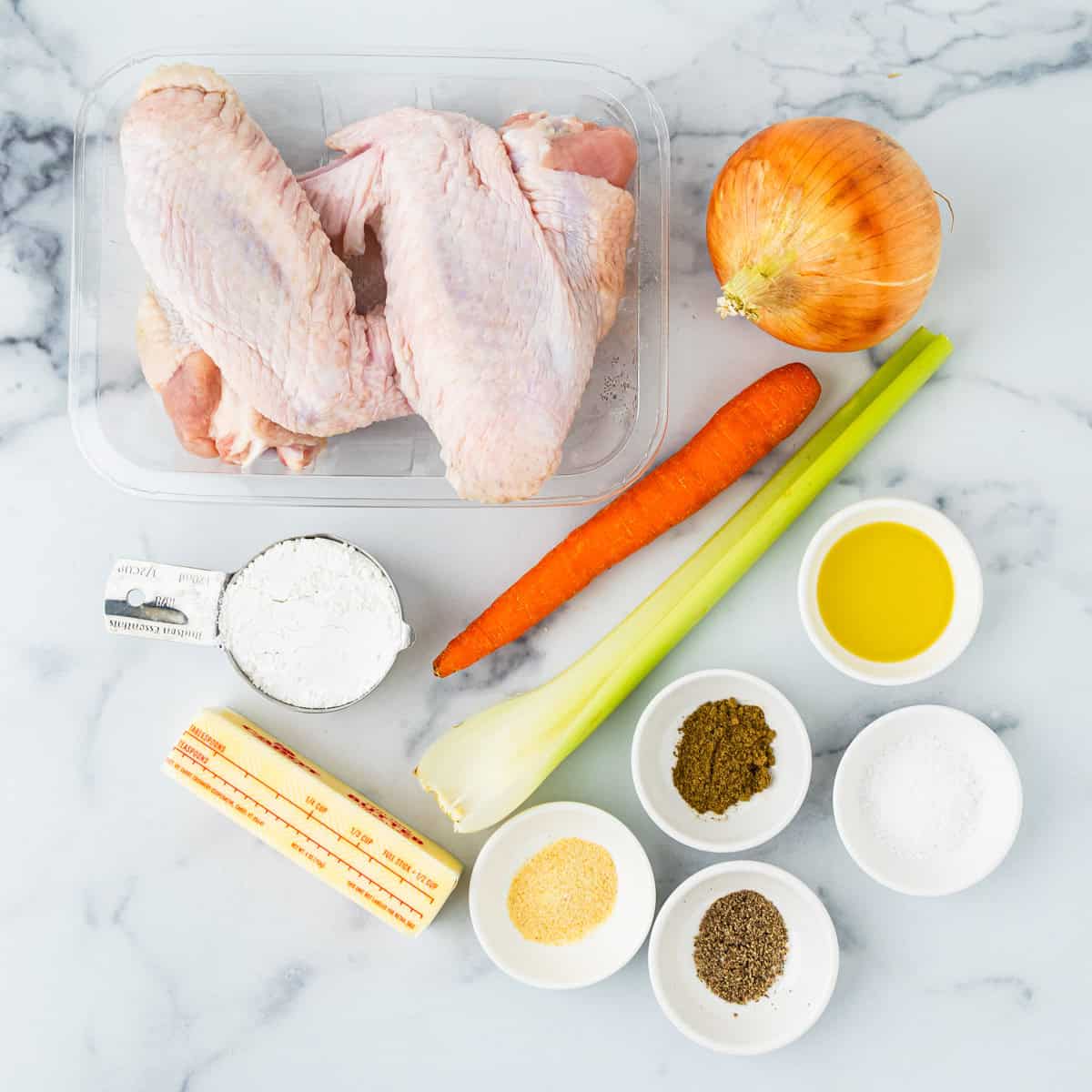 Ingredients for make ahead turkey gravy arranged on a countertop.